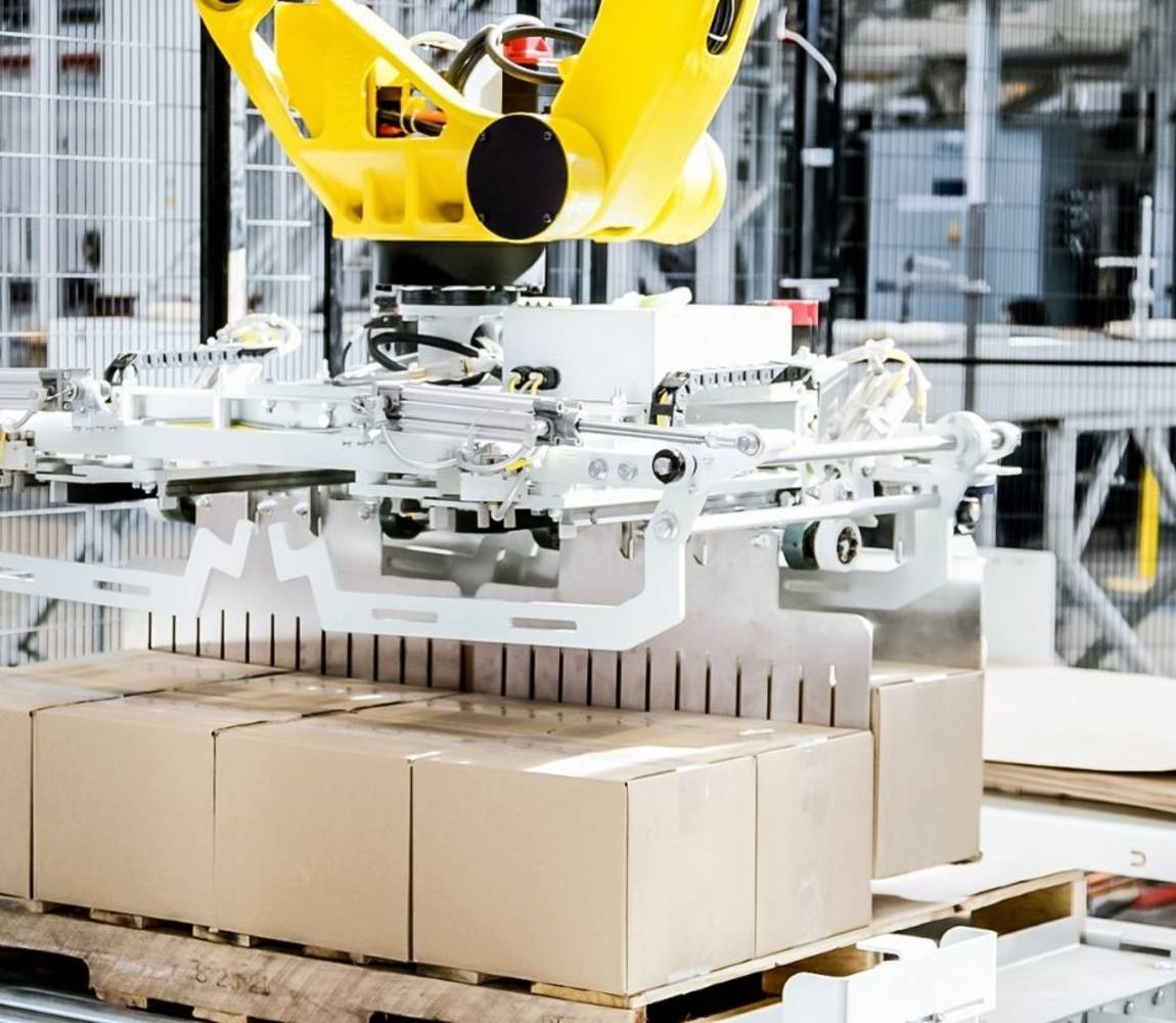 Robotic palletizer placing boxes on a pallet